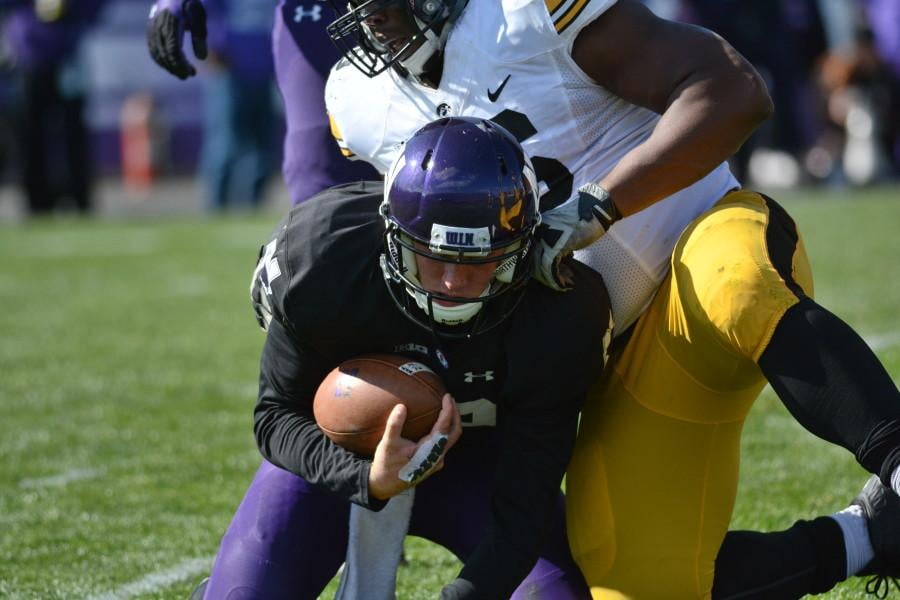 Quarterback Clayton Thorson gets sacked in the first half. The redshirt freshman struggled throughout the game, completing fewer than half his passes for just 125 yards while also throwing an interception.