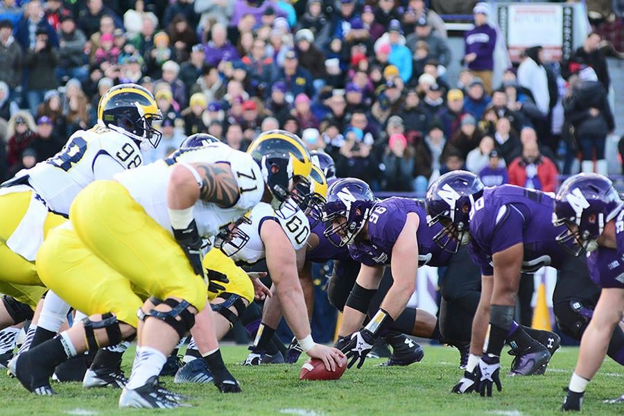 Michigan’s offensive line faces off against Northwestern’s defensive line in last year’s game. Both sides this week emphasized the importance of dominating the trenches.