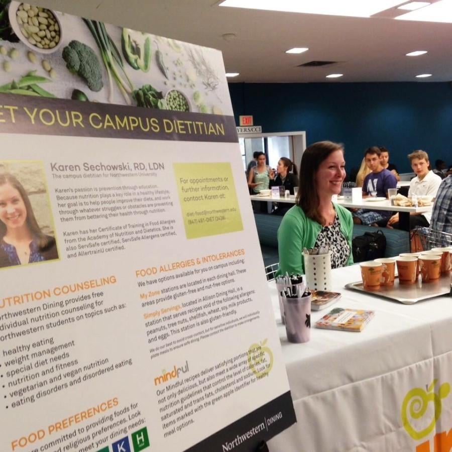 Karen Sechowski smiles at students during one of her “Meet the Dietitian” booths at Sargent Hall. The new dietitian, hired June, hopes to aid students with nutrition needs and also works to assist those with eating disorder concerns.