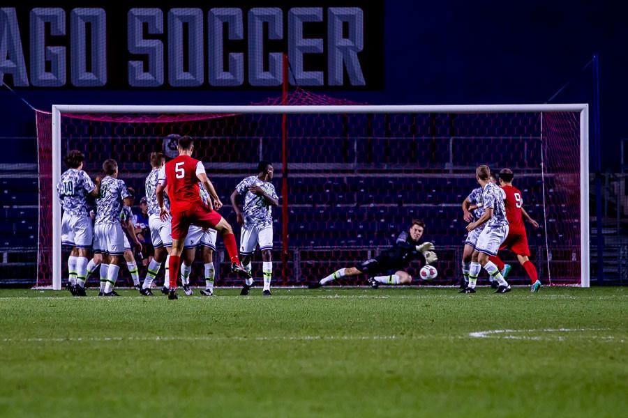 Zak Allen saves a free kick. The senior goalkeeper has been successful on the field as of late, and his work in goal is part of the reason the Cats are right back in the conversation to make the NCAA Tournament.