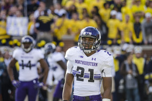 Justin Jackson looks to the sideline for a play call. The sophomore running back believes running the ball effectively will continue to be essential to Northwestern’s offense.