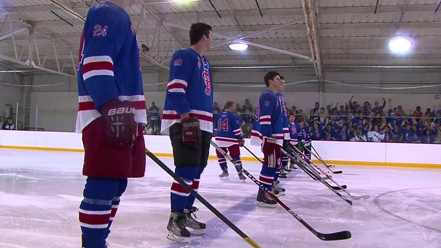 Members of fraternity Beta Theta Pi at Indiana University line up before a game against Sigma Chi. The game was organized by Dropping the Puck on Cancer, a nonprofit that raises money for brain cancer research. 