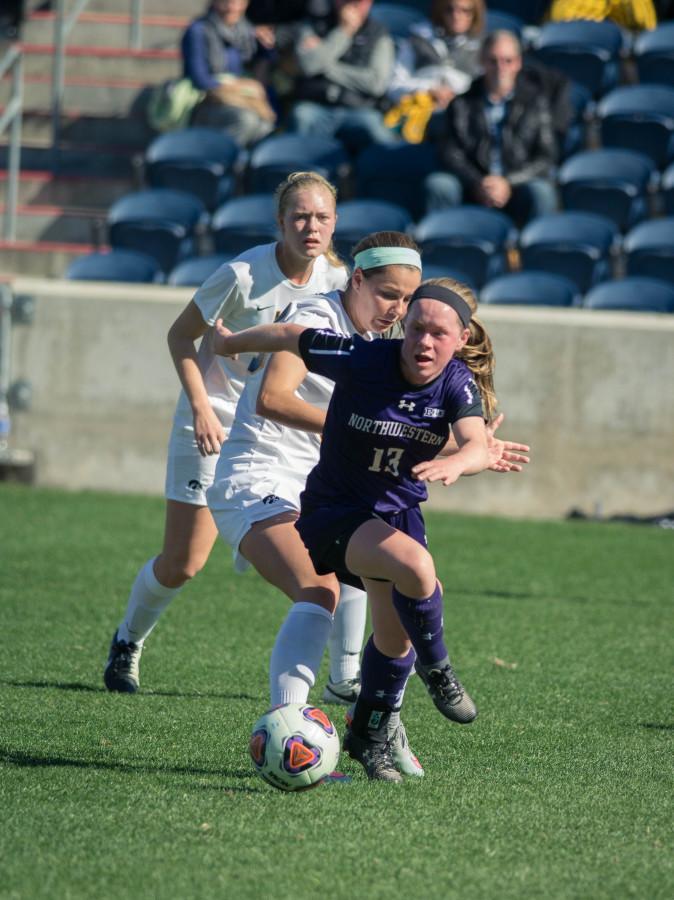Michelle Manning sprints up the pitch with the ball. The sophomore forward will need to help the Cats produce some goals if they want to knock off Big Ten front-runner Wisconsin.