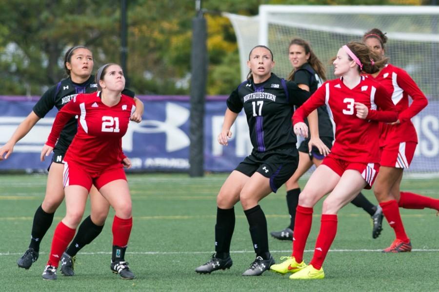 Junior midfielder Maria Grygleski and sophomore midfielder Kim Jerantowski search for the ball in the air. NU was unable to capitalize on balls in the air, and that was part of its demise against Nebraska.