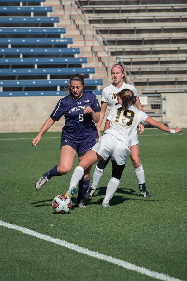 Suzanne Malherbe looks to escape the pressure of the defense. The senior forward played a season-high 41 minutes in NU’s victory over Illinois on Saturday.