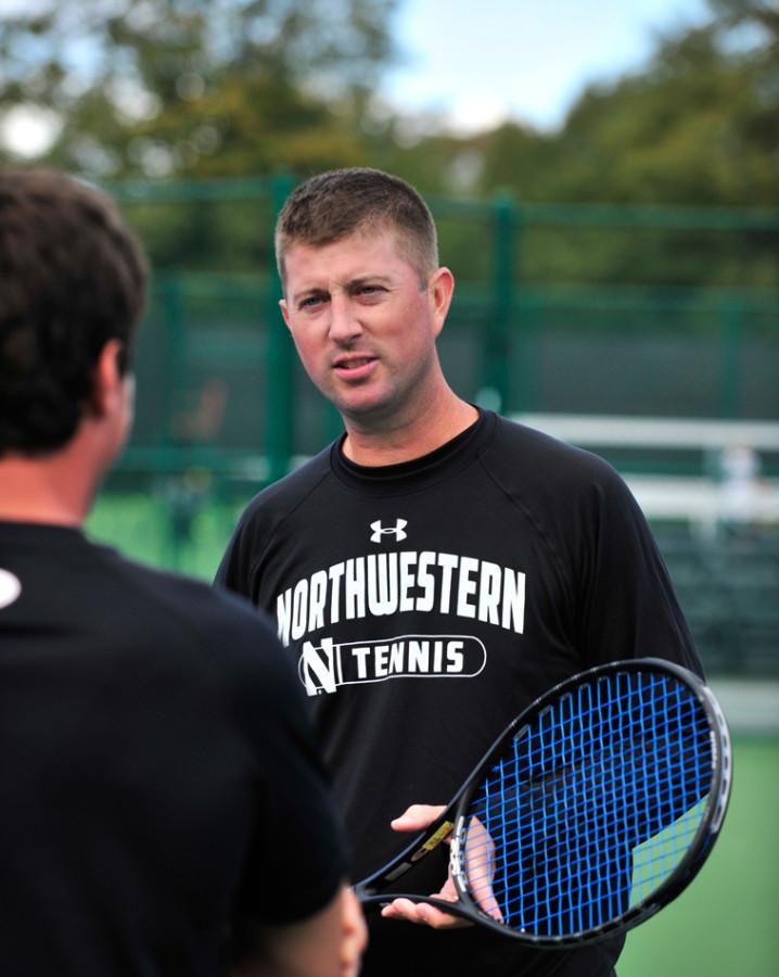 Coach Arvid Swan talks with a player. Swan’s team has not completed as a whole lately, with only the freshmen competing at Big Ten Indoors and only junior Konrad Zieba playing at the National Indoor Championships.
