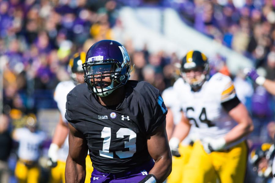 Deonte Gibson runs upfield. The senior defensive end has been a key contributor on and off the field for Northwestern with his production and leadership.