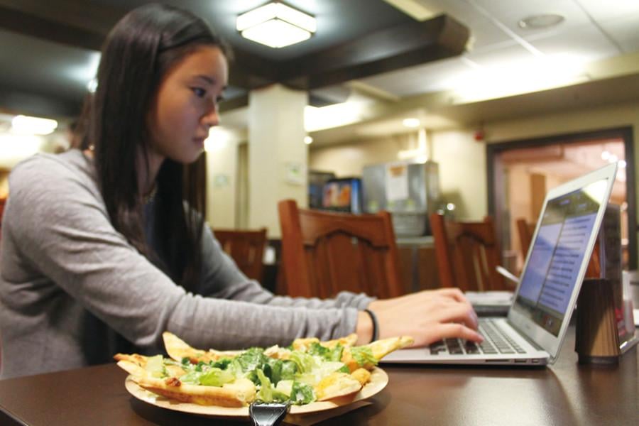 A Northwestern student dines at Fran’s Cafe. Sodexo has said there are currently no plans to take action regarding last week’s health report that there is a link between processed meat and cancer.