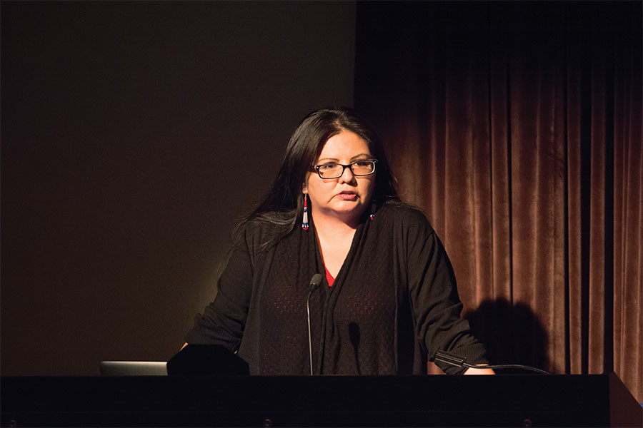 Navajo artist and filmmaker Pamela Peters discusses her recent multimedia project on Native American youth in Los Angeles at Helmerich Auditorium on Thursday. Peters also spoke about the challenges facing Modern Indians like cultural appropriation and assimilation. 