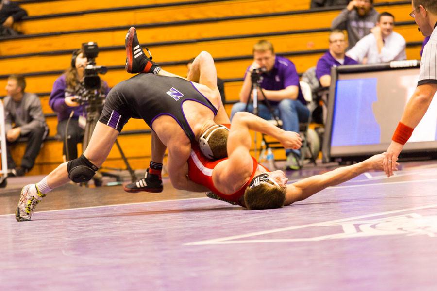 A Wildcat takes down his opponent. NU’s wrestlers experienced varying results over the weekend, with senior Dominick Malone having the best performance.