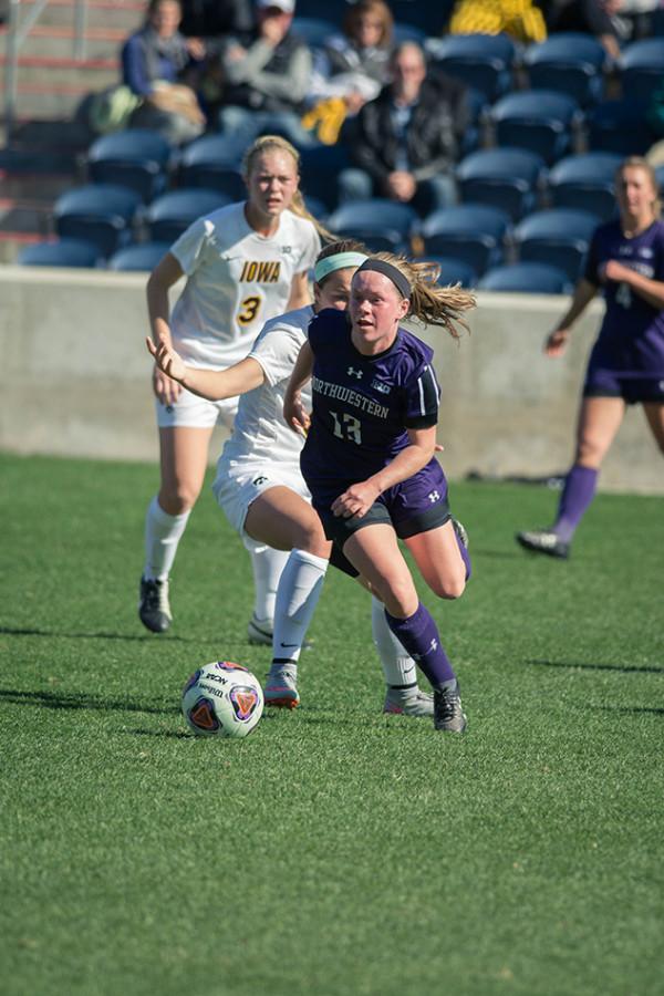 Michelle Manning dribbles upfield during an October game against Iowa. The sophomore forward scored the game-winning goal in double overtime during Saturdays match against Washington State.