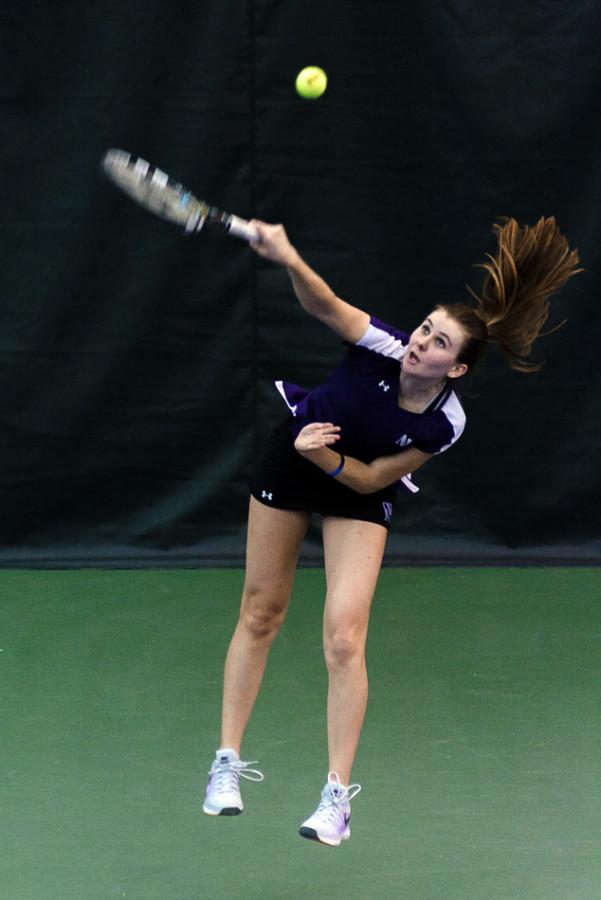 Erin+Larner+leaps+as+she+serves+the+ball.+The+sophomore%2C+who+is+trying+to+work+her+way+back+from+injury%2C+was+doubles+partners+with+freshman+Lee+Or+over+the+weekend.