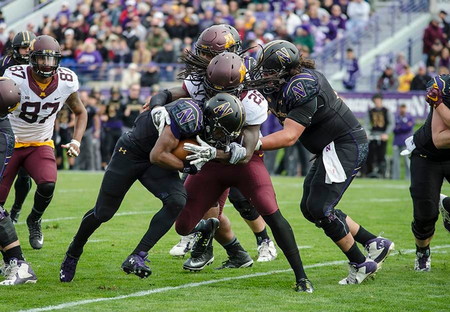 Justin Jackson runs into a Minnesota defender. The sophomore running back will be tasked with keeping Northwestern out of third-and-long situations against a tough Tennessee defense.