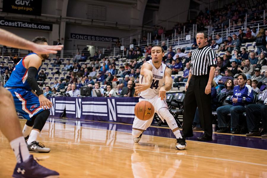 Tre Demps passes around a defender. After a slow start, the senior guard exploded for 23 points and a career-high nine rebounds in the dominant win over Chicago State.