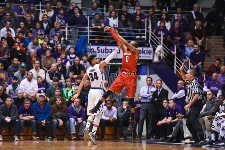 Maryland guard Rasheed Sulaimon shoots a jumper over junior forward Sanjay Lumkpin. The Maryland backcourt scored 40 of the Terrapins 72 points. 