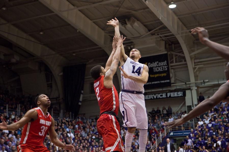 Tre Demps lifts a shot over a defender. The senior guard was the face of Northwestern’s shooting struggles Wednesday, going 3-for-17 from the field.