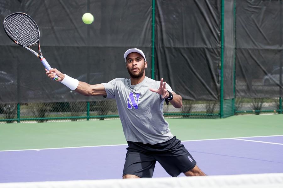 Sam Shropshire returns the ball with a volley. The junior lost in straight sets during his singles match against Illinois on Saturday.