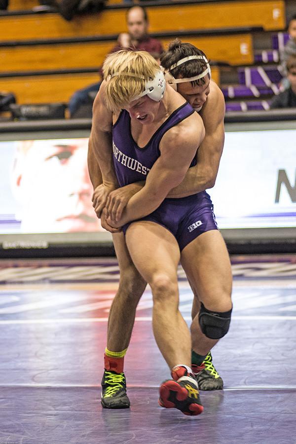 Luke Norland wrestles with an opponent. The freshman will be looking to rebound from his 6-0 loss two weeks ago.