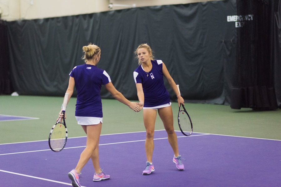 Alex Chatt (right) shakes her teammate’s hand. With Northwestern fully healthy, the sophomore will be looking to help the Wildcats regain their place at the top of the Big Ten. 