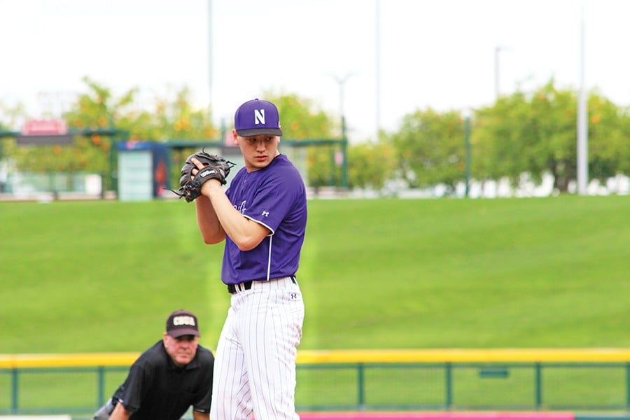 Joe Schindler sets up for a pitch. The junior pitcher threw five shutout innings to help Northwestern to an opening-day victory over Nevada at the Chicago Cubs’ Spring Training stadium.