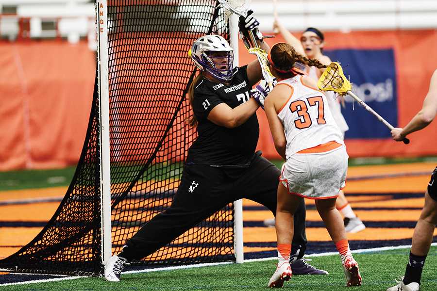 Mallory+Weisse+attempts+to+save+a+shot+from+an+opposing+Syracuse+player.+The+freshman+goalie+made+7+saves+in+Sunday%E2%80%99s+loss.+