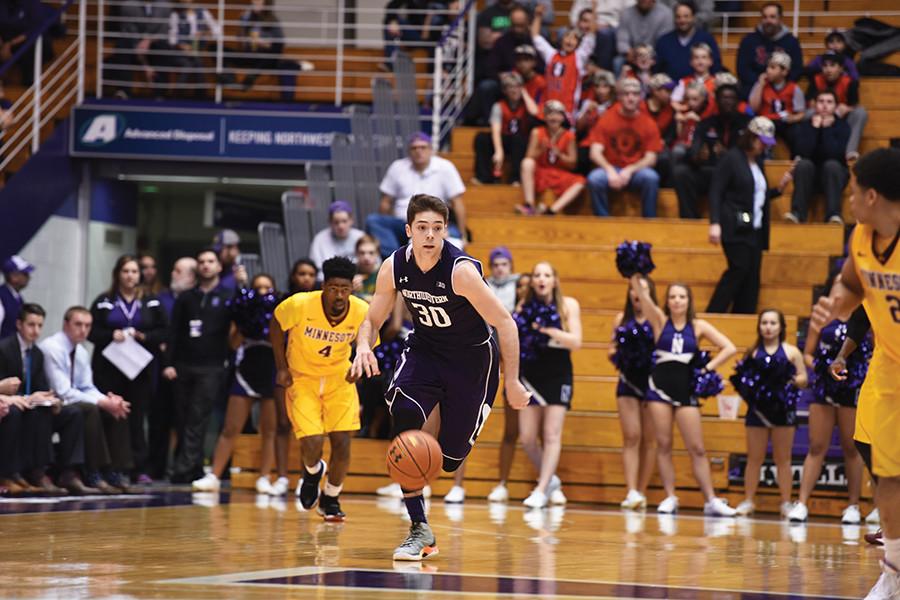 Bryant McIntosh dribbles up the court. The sophomore guard set the Northwestern school record for most assists in a single season Thursday.