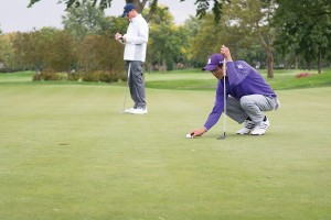 A Northwestern golfer eyes the ball on the green. The Wildcats finished third in last year’s Southwestern Jones Invitational. 