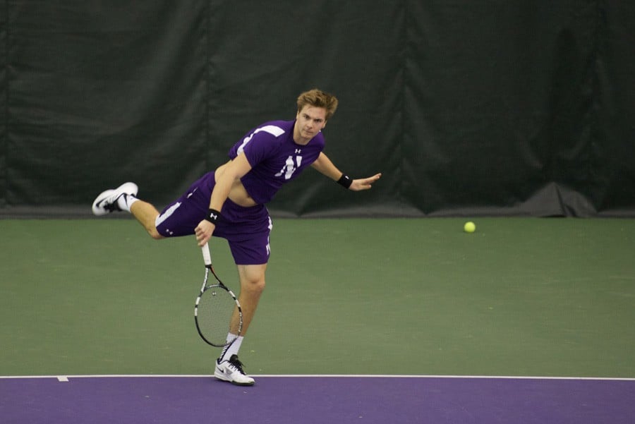 Fedor Baev fires a shot toward his opponent. The senior won the deciding point in a 7-0 Northwestern victory over No. 32 Harvard on Sunday.