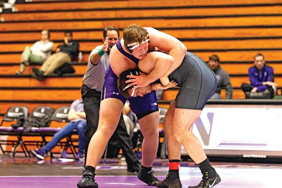 Conan+Jennings+wraps+up+an+opponent.+The+redshirt+freshman+pulled+out+a+last-second+victory+in+the+final+match+of+Friday+night%E2%80%99s+dual+with+Duke%2C+giving+Northwestern+it%E2%80%99s+second+victory+of+the+season+on+Senior+Night.