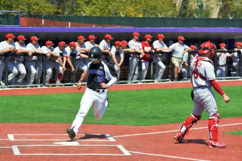 RJ Watters crosses the plate for a run. The junior outfielder made the most of his starts over spring break, including a diving catch at the warning track Sunday. 