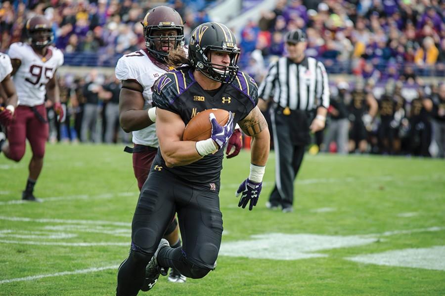 Dan Vitale turns upfield. The former Northwestern superback boosted his draft stock as one of the top performers in various athletic drills during the weekend’s NFL Draft Combine.
