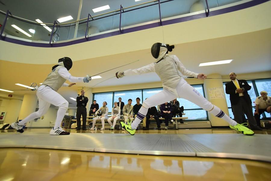 A Northwestern fencer lunges toward her opponent. The Wildcats won the Midwest Conference Championship this weekend, the fourth such title of coach Laurie Schiller’s career.
