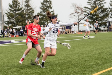 Lauren Murray catches a pass from her teammate. The senior midfielder has been essential to Northwestern’s defense this season. 