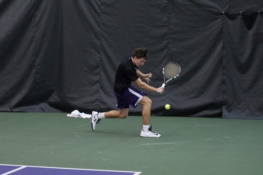 Alp Horoz prepares a backhand stroke. The junior helped lock down Sunday’s doubleheader, winning both of his singles matches. 