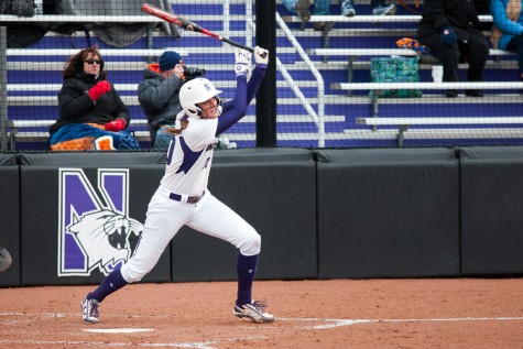 Andrea Filler watches her hit after making contact. The senior shortstop leads Northwestern in batting average through the team’s first 28 games. 