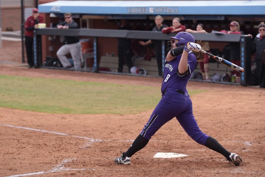 Amy Letourneau takes a swing. The senior pitcher tied a school record Friday, hitting eight RBIs in a victory over New Mexico State.