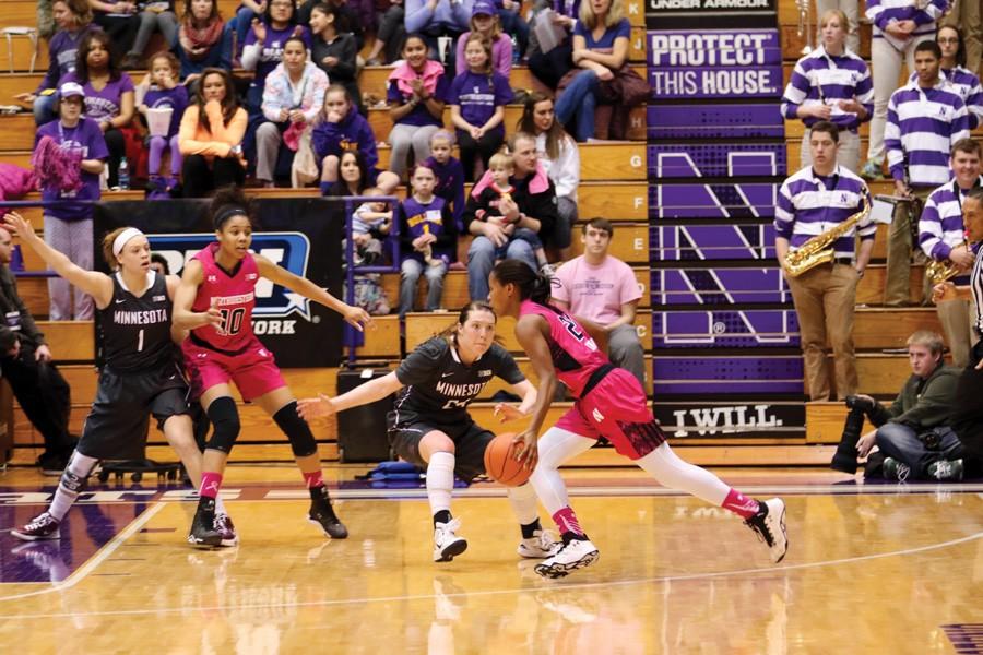 Christen Inman dribbles around a defender. The junior guard scored 14 of her 18 points in the fourth quarter, helping NU clinch the quarterfinal game against Indiana. 