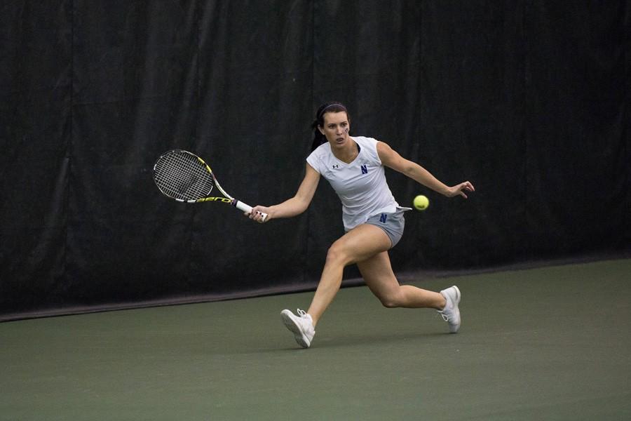 Jillian Rooney lunges for the ball. The junior fought hard over spring break, but ultimately fell to her Longhorn opponent in the only match she completed in Texas.

