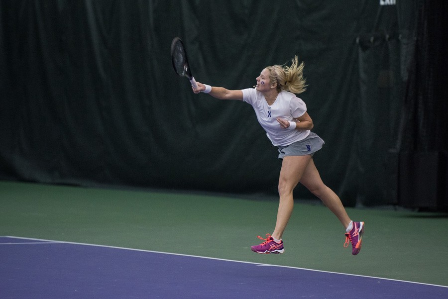 Alex Chatt serves the ball to her opponent. The sophomore has helped lock down the No. 1 doubles slot for the Wildcats, winning 3-of-5 thus far. 