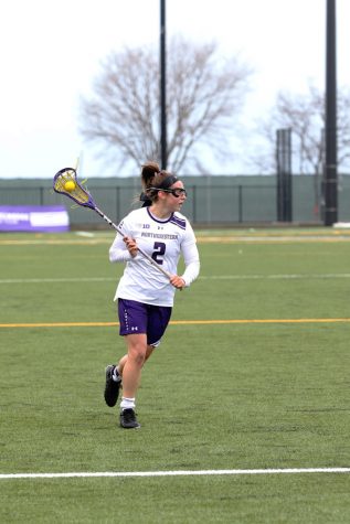 Selena Lasota cradles the ball. The sophomore midfielder has scored 26 goals through the Wildcats’ first 12 games.