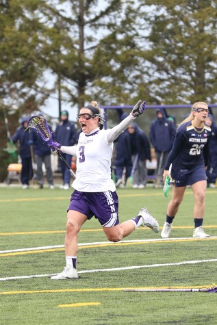 Christina Esposito celebrates a goal against Notre Dame on Sunday. The junior attacker put 4 of the Wildcats’ 17 goals in the net. 