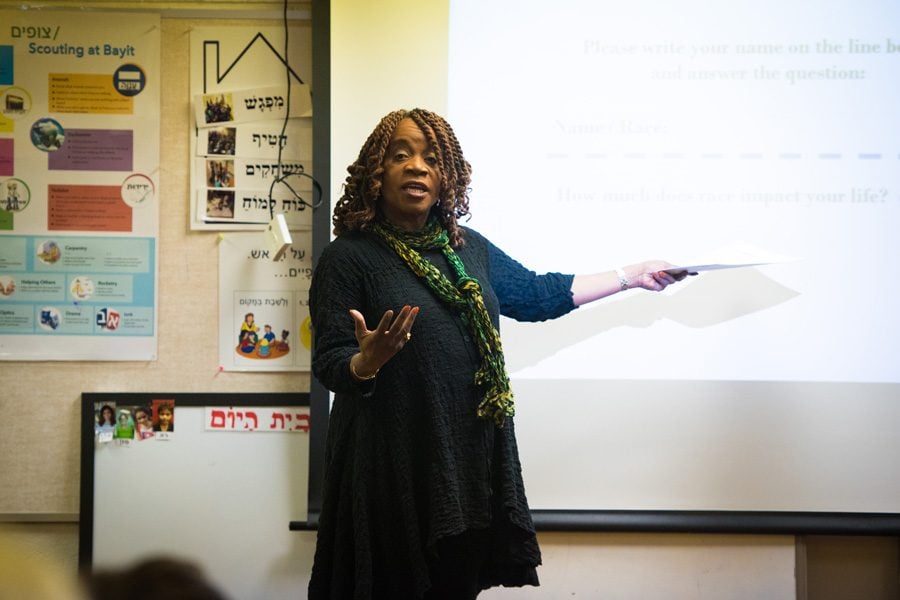 ETHS/D202 Board President Pat Savage-Williams speaks Tuesday night at an event hosted by the Organization for Positive Action and Leadership of Evanston. Savage-Williams talked about racial disparities in the education system and her own experiences at ETHS. 