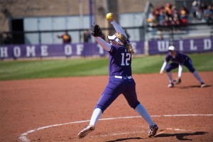 Kenzie Ellis prepares to throw the ball. The freshman pitcher was roughed up in Sunday’s opening game, allowing 8 runs in 4 innings of work. 
