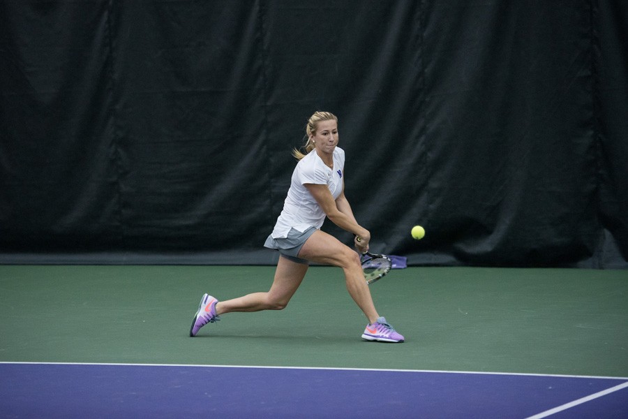 Maddie+Lipp+lunges+for+a+backhand.+The+sophomore+is+17-10+in+her+overall+in+singles+matches+this+year.+
