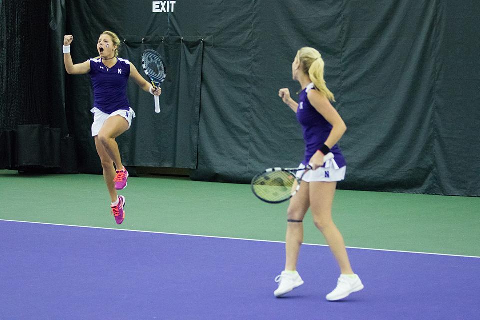 Alex+Chatt+%28left%29+celebrates+with+partner+Maddie+Lipp+after+winning+at+No.+1+doubles+Friday+against+Michigan.+The+Wildcats+snapped+the+Wolverines%E2%80%99+37-game+Big+Ten+winning+streak+with+the+victory.
