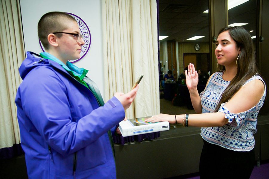 Associated Student Government president and SESP junior Christina Cilento (left) swears in SESP junior Anna DiStefano as a co-vice president for student life at Wednesday’s Senate meeting. Senate rejected the nomination of SESP sophomore Sumaia Masoom as the other co-vice president for student life.