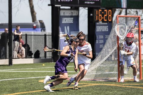 Christina Esposito tries to evade a defender. The junior attacker led the Wildcats with 3 goals in Sunday’s loss to Maryland.