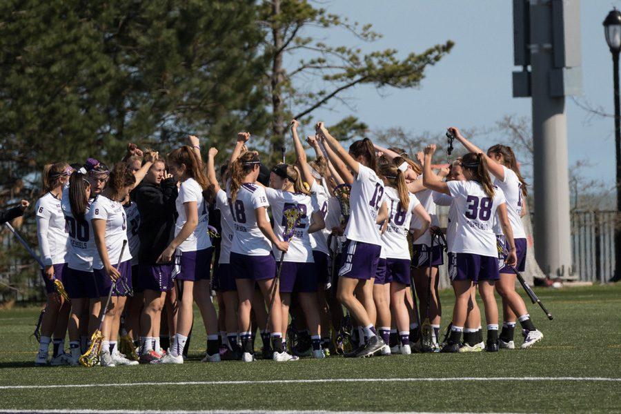 Northwestern gathers during a break in play. If the Wildcats defeat Louisville on Friday, they will face Notre Dame.