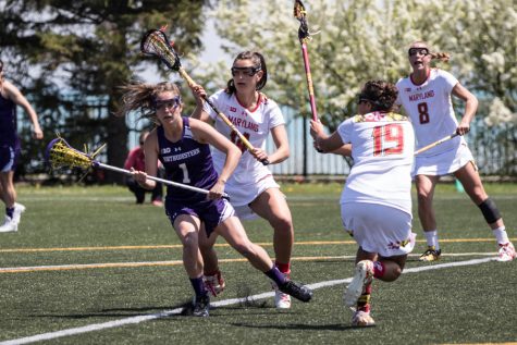 Catie Ingrilli is swarmed by Maryland defenders. The junior midfielder was unable to get things going on offense, only taking one shot in the loss. 