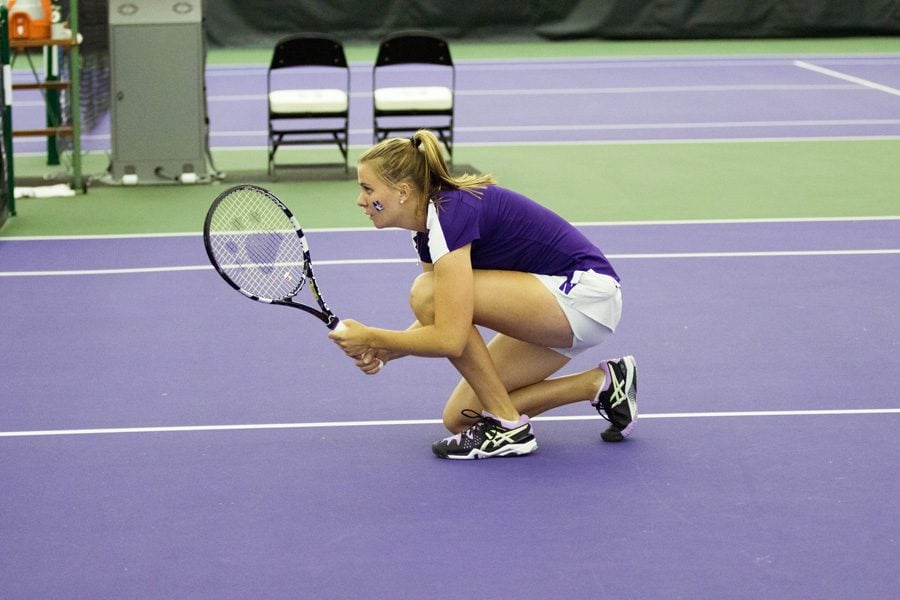 Erin Larner kneels before a doubles point. The sophomore is part of the Wildcats’ three-headed sophomore monster with a 9-6 record at the No. 1 singles spot.